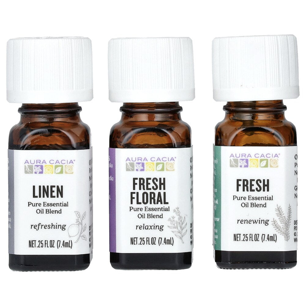Three Aura Cacia Fresh Home blend bottles labeled Linen, Fresh Floral, and Fresh.
