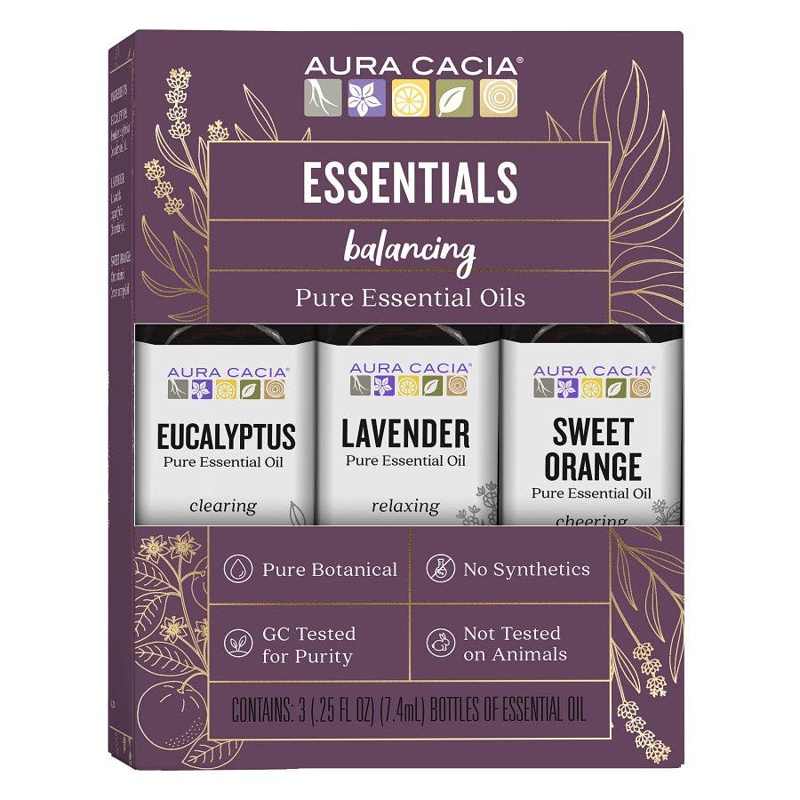 Aura Cacia Essentials Kit with Eucalyptus, Lavender, and Sweet Orange bottles in a purple box.