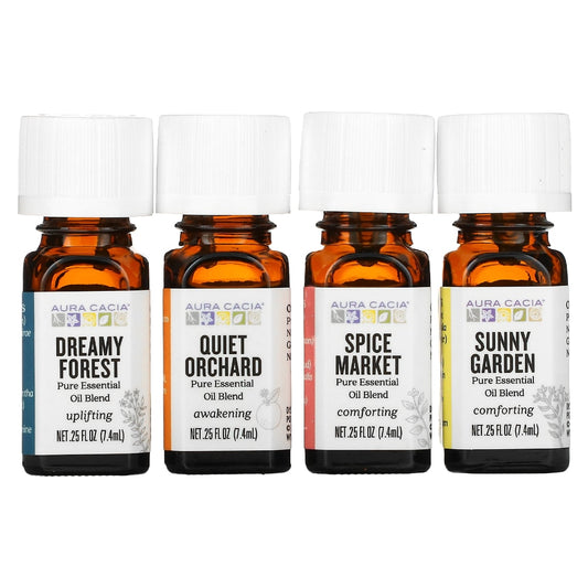 Four Aura Cacia blend bottles labeled Dreamy Forest, Quiet Orchard, Spice Market, and Sunny Garden.